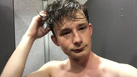 A pretty young boy is filming himself having solo fun