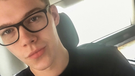 Young boy with glasses filming himself masturbating