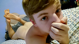 Webcam video featuring a young boy and his dildo