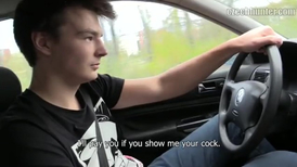 Dude is driving the car while a lad is teasing him