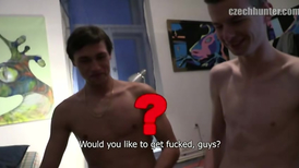 Two skinny dudes are stroking each others cocks