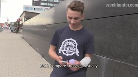 Skinny lad with blond hair showing his nice abs