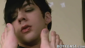 Emo guy is giving a foot massage before blowing